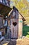 Wooden ecological compost toilet with a heart shape in the door