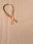 Wooden edge veneer curl on a natural paper,symbol for Liver Cancer awareness, World Cancer Day