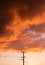 Wooden electricity distribution pole and cables at sunset. Upright UK