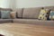 Wooden empty table in front of Living room sofa interior