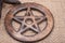 Wooden encircled pentagram symbol on burlap. Five elements
