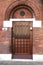 Wooden entrance door with three door-locks