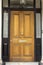 Wooden Entrance Door to residential building in London. Typical door in the English style.