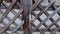 Wooden entrance gate with metallic lock of a house