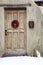 Wooden Entryway with Ristra Wreath in Santa Fe New Mexico