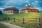 Wooden ethnic houses on rural landscape, Kossovo, Brest region, Belarus.