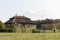 Wooden ethnic houses on rural landscape - village of birthplace of Tadeusz Kosciuszko - Kossovo, Belarus