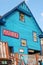 Wooden facade of a colorful blue Post Office