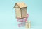 Wooden family figurines, model house. Real estate purchase, rental concept