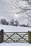 Wooden farm gate in winter