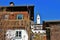 Wooden farmhouses and church in Goldegg, Austria, Europe.