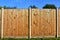 Wooden featheredge garden fence with concrete support posts