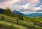 Wooden fence across the hill