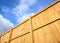 Wooden fence against a cloudy sky