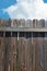 Wooden fence against sky