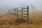 A wooden fence on a foggy winter morning on the Gettysburg National Military Park in Gettysburg, PA, USA