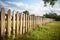 Wooden Fence in Grassy Field