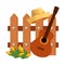 wooden fence with guitar and gardener straw hat