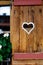 Wooden fence with heart. Part of a window in Tirol, Austria