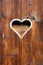 Wooden fence with heart. Part of a window in Tirol, Austria