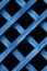 Wooden fence lattice toned blue. Wood grating close-up. Abstract wood texture