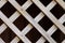 Wooden fence lattice. Wood grating close-up. Abstract wood texture