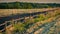 Wooden fence in the livestock feeding field, panoramic evening landscape