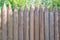 Wooden fence made of sharpened logs