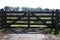 Wooden fence at a meadow with no trespassing warning on it in Nieuwerkerk aan den IJssel.