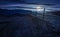 Wooden fence in mountainous countryside at night