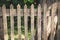 Wooden fence of parallel laths