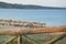 Wooden Fence and Parasols on the Beach