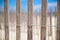 A wooden fence wrapped in wire at the beach to prevent erosion