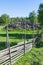 Wooden fences with a stone cairn