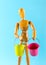 Wooden figure holding two empty buckets