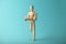 Wooden figure of man with artificial prosthetic leg. Amputee and disability concept