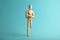 Wooden figure of man with artificial prosthetic leg. Amputee and disability concept