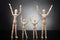 Wooden Figure Parents And Dummy Children Raising Their Arms
