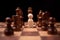 Wooden figures businessman standing confront of chess king and being in the chess circle. New business players are facing