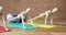 Wooden figurine exercising on exercise mat