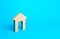 Wooden figurine of a house with a large door. Arch on a blue background. Affordable housing. Rent of real estate. Construction