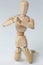 Wooden figurine kneeling with both hands joined