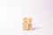 Wooden figurines of a young family on a white background. Concept of a young strong and healthy married couple.