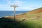 Wooden finger post marking coast path