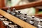 Wooden fingerboard of the guitar, pegs and strings close-up