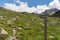 Wooden fingerpost in the French Pyrenees pointing along a footpath to the Refuge du Rulhe, Laparin and the Etangs de Fontargente