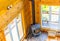 Wooden fireplace in a wooden cottage in forest