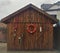 Wooden fisherman barn shack with lifebelt