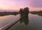 Wooden fisherman& x27;s hut and pedestrian bridge at sunrise