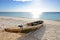 Wooden Fishing boat on a beach with blue sky